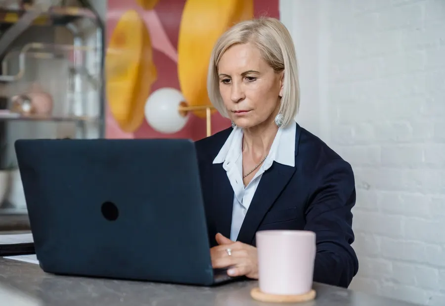Adult working with a computer in an everyday setting